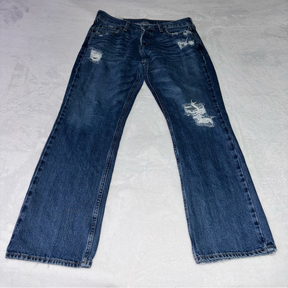The Hollister Boot Distressed Men’s Mid-Wash Bootcut Jeans Size 32 x 30